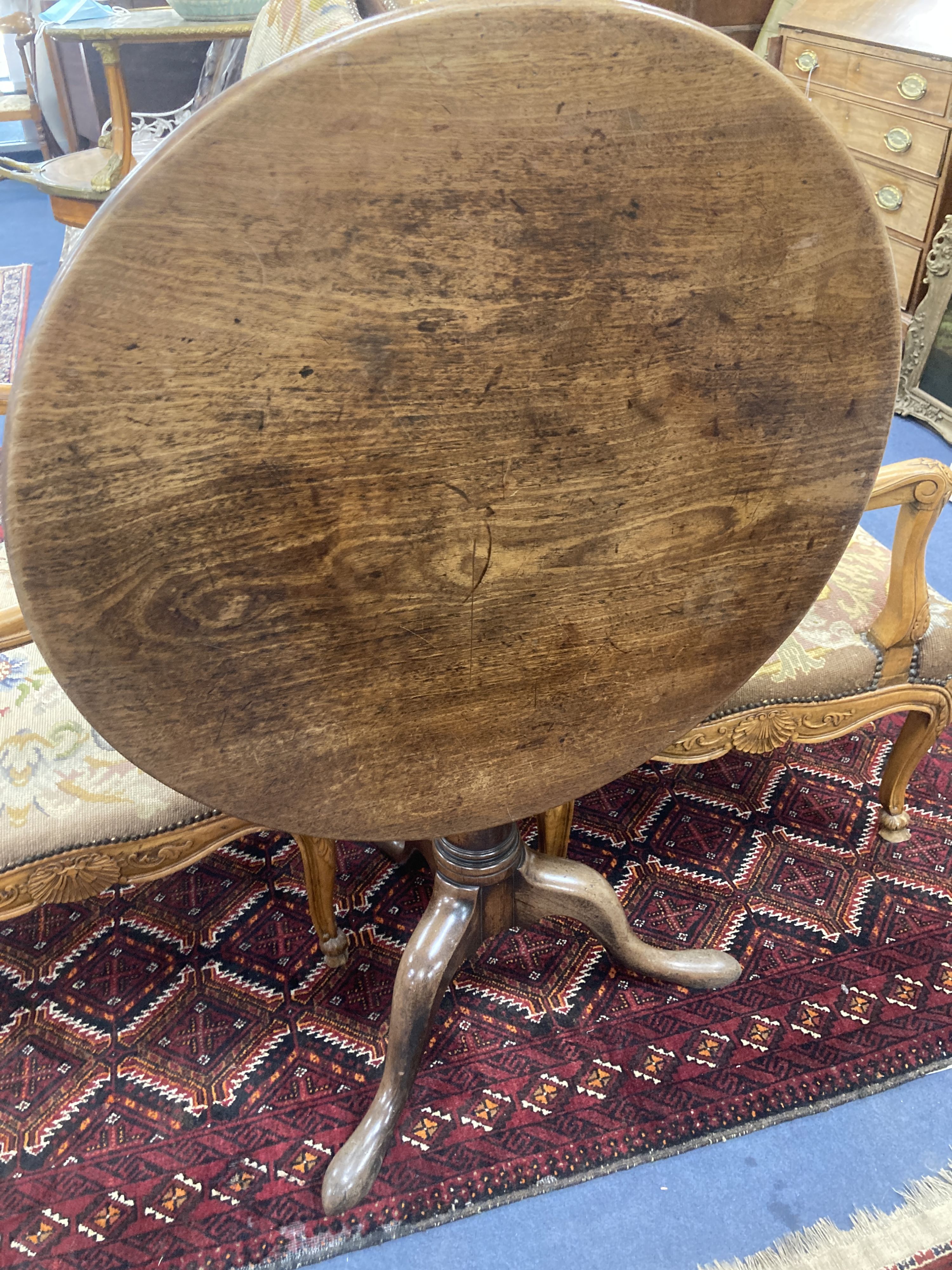 A mid 18th century mahogany tripod table with birdcage platform, diameter 76cm, height 70cm